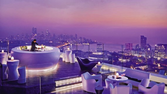 In a busy and humid city, a rooftop bar can be a wonderful escape from the street sounds and the heat. In Mumbai, The Four Season Hotel’s Aer rooftop bar is ‘heaven’ to the local business scene as well as visitors.   At Aer, 34 floors above street level, you will not hear much of the noise of Mumbai’s traffic. The Four Seasons’ open-air bar and lounge offers a generous 5.30pm to 8pm Happy Hour, with half-price cocktails and champagnes. Mumbai’s most famous rooftop bar draws a different crowd later in the evening, when DJ Fatbat (a.k.a Shaan) plays jazz, funk, house, club as well as classic hits from the 80s and 90s.